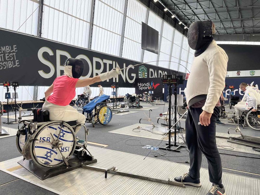 Israel fencer training Paris — ISR custom wheel cover