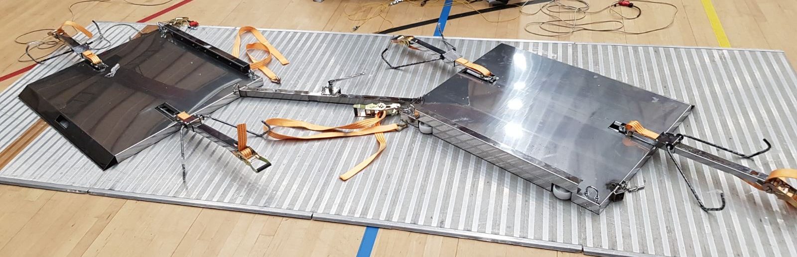 Fencing frame disassembled for transport — stacked components